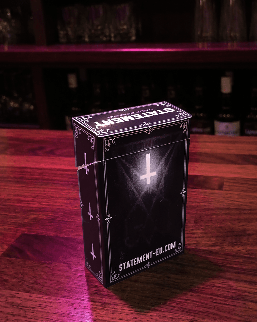 Demonic cigarette pack in a bar back view