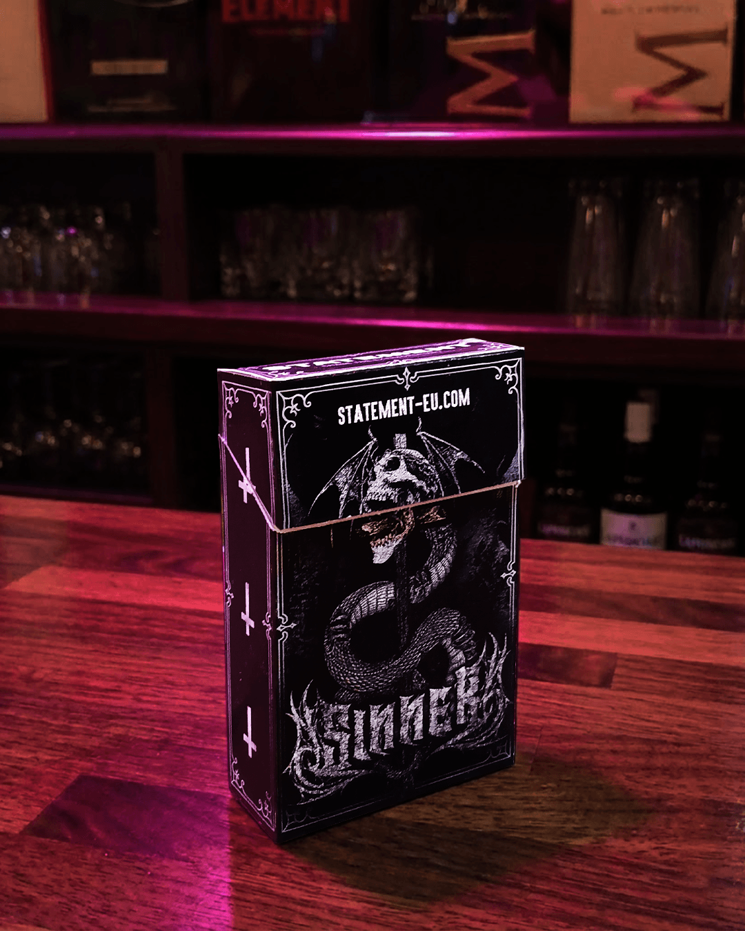 Heavy metal cigarette pack in a bar